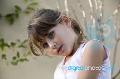 Little Girl Posing Outdoors Stock Photo