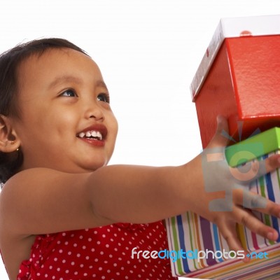 Little Girl Receiving Gifts Stock Photo