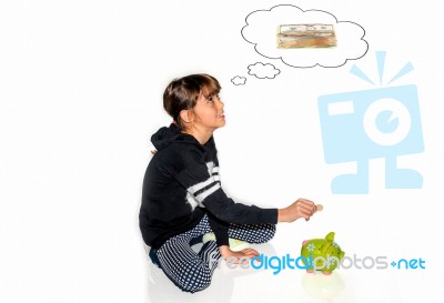 Little Girl Saving Money In Piggy Bank Stock Photo