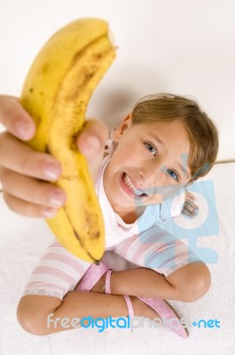 Little Girl Showing You Banana Stock Photo