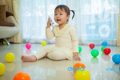 Little Girl Talking On Mobile Phone Stock Photo