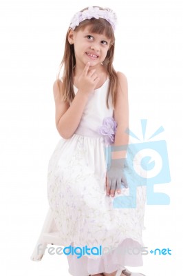 Little Girl Wearing White Dress And Posing On Chair On White Bac… Stock Photo