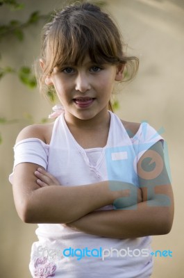 Little Girl With Crossed Arms Stock Photo