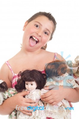 Little Girl With Dolls Stock Photo