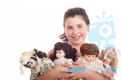 Little Girl With Dolls Stock Photo