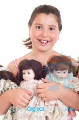 Little Girl With Dolls Stock Photo