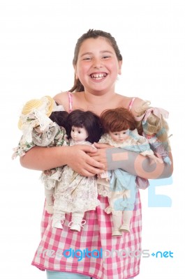 Little Girl With Dolls Stock Photo