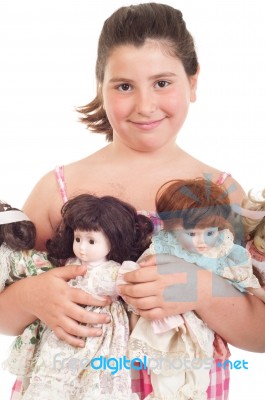 Little Girl With Dolls Stock Photo