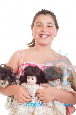 Little Girl With Dolls Stock Photo