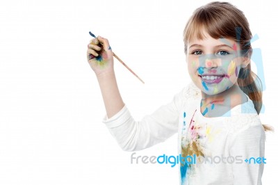 Little Girl With Painting Stock Photo