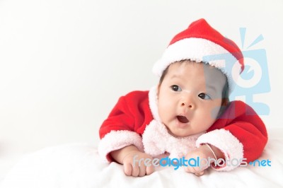 Little Girl With Santa Costume Stock Photo