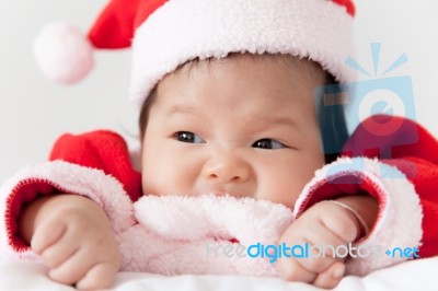 Little Girl With Santa Costume Stock Photo