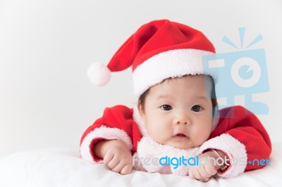 Little Girl With Santa Costume Stock Photo