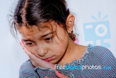 Little Girl With Toothache In White Background Stock Photo