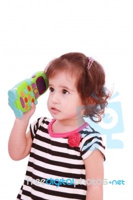 Little Girl With Toy Phone Stock Photo