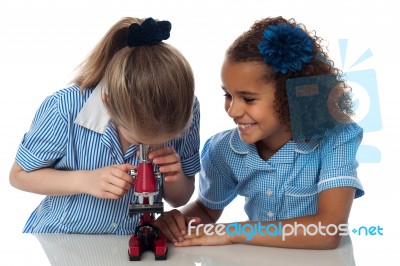 Little Girls Looking Into Microscope Stock Photo