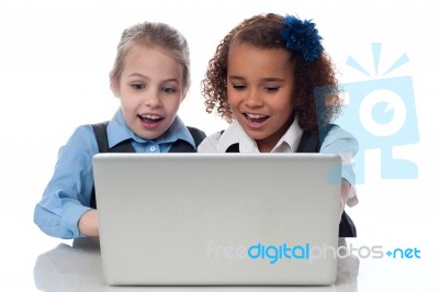 Little Girls Playing Games On Laptop Stock Photo