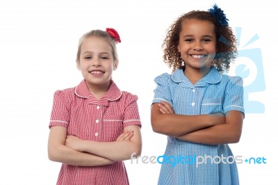 Little Girls Posing With Arms Crossed Stock Photo