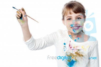 Little Smiling Girl Being Artistic Stock Photo