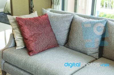 Living Room With Row Of Pillows On Sofa At Home Stock Photo