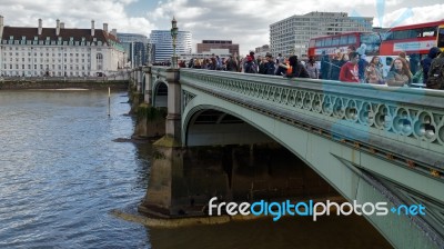 London/uk - March 21 : Tourists Thronging Westminster Bridge In Stock Photo