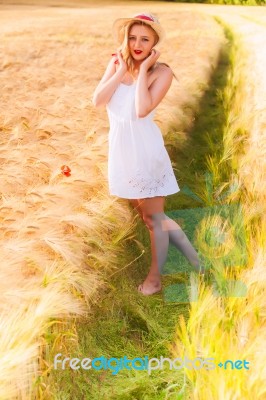 Lonely Beautiful Young Blonde Girl In White Dress With Straw Hat… Stock Photo