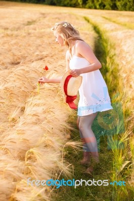 Lonely Beautiful Young Blonde Girl In White Dress With Straw Hat… Stock Photo