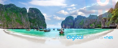 Long Boat And Blue Water At Maya Bay In Phi Phi Island, Krabi Thailand Stock Photo