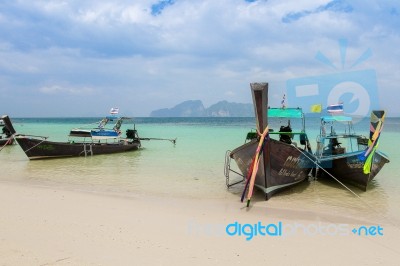 Long Boat At Tropical Beach, Thailand Stock Photo