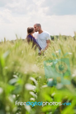 Long Shot Of The Couple Giving Mouth Kiss Stock Photo