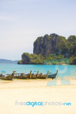 Long Tail Boats On A Beach In Thailand Stock Photo