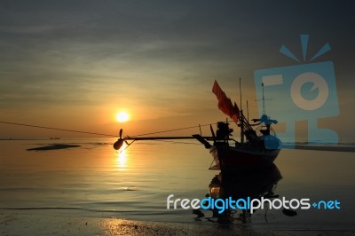 Longtail Boat In The Sunrise Over Sea And Blue Sky Stock Photo