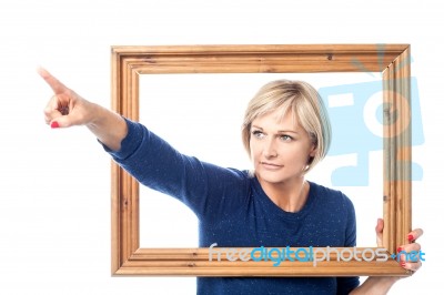 Look At That Thing. Woman Pointing Away Stock Photo