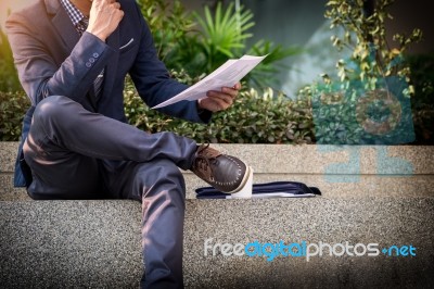 Looking For The Right Document. Confident Young Business Man In Stock Photo