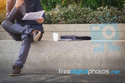 Looking For The Right Document. Confident Young Business Man In Stock Photo