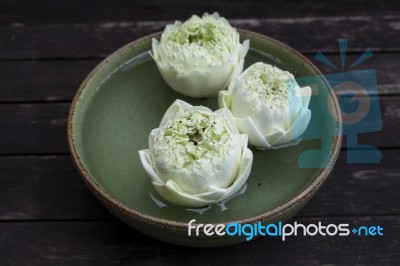 Lotus Flower Floating In Green Bowl Stock Photo