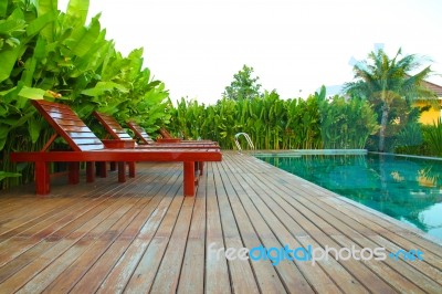 Lounger In Swimming Pool Stock Photo