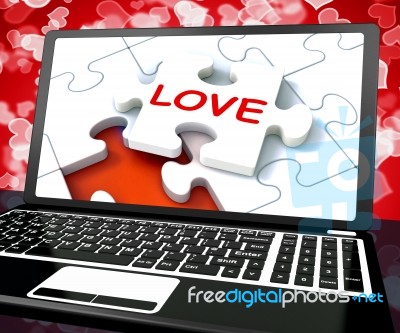 Love Puzzle On Laptop Shows Internet Dating Stock Image