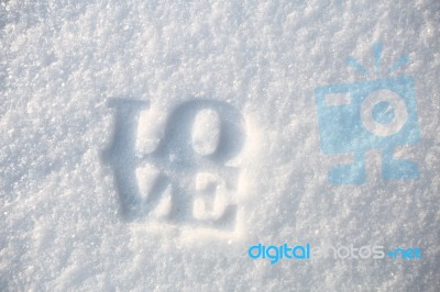 Love Word On White Snow Stock Photo