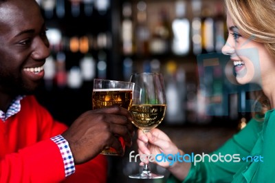 Lovely Couple Enjoying Drinks At Night Club Stock Photo