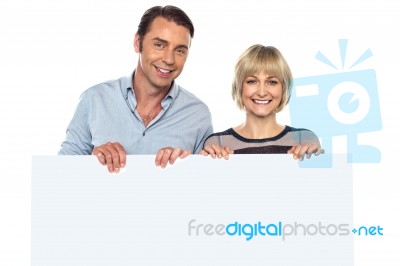 Lovely Couple Standing Behind Blank Billboard Stock Photo