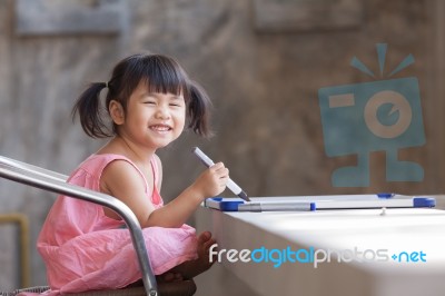 Lovely Face Of Toothy Smiling Asian Children Practive To Writing… Stock Photo