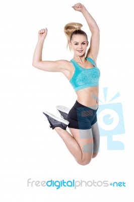 Lovely Woman Jumping In Air Stock Photo