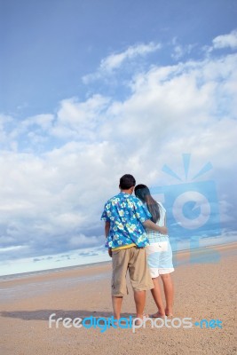 Lovers On The Beach Stock Photo