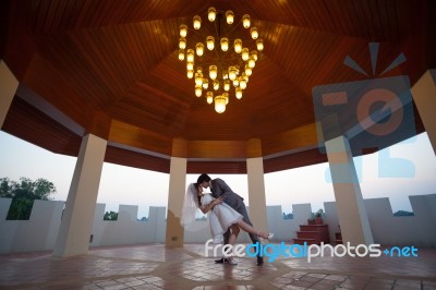 Loving Asian Couple Indoor Stock Photo