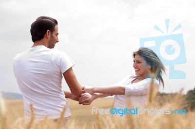 Loving Couple In Field Stock Photo