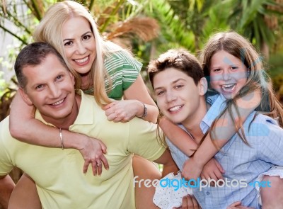 Loving Father And Son Gives Piggyback Stock Photo