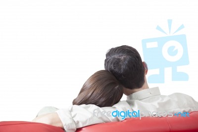 Loving Young Couple Relaxing On Sofa Stock Photo