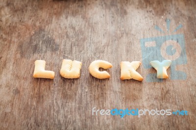 Lucky Alphabet Biscuit On Wooden Table Stock Photo