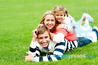 Lying Family In Outdoor Stock Photo